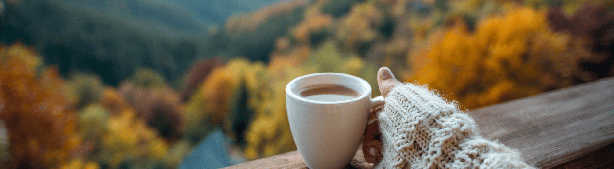 Cup of warm beverage while looking out window